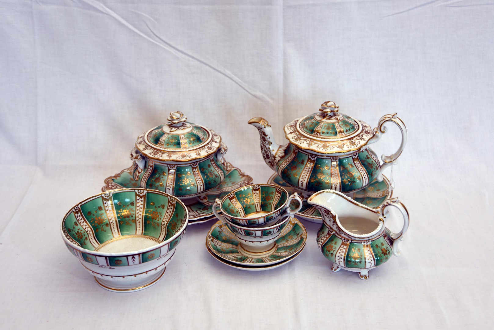 A mid 19th century Ridgways porcelain tea set comprising teapot, cover and stand, milk jug, sucrier,