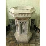 A carved font with Gothic style arched pedestal on a hexagonal plinth base. Est £200-300