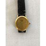 A Baume & Mercier ladies gold coloured metal cased wristwatch, the oval dial with baton numerals and