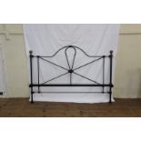 A Victorian style double bed with cast iron head and footboard. Est £25-40