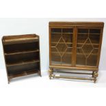 An Oak glass fronted two door display cabinet bookcase on raised bracket supports, 128cm high,