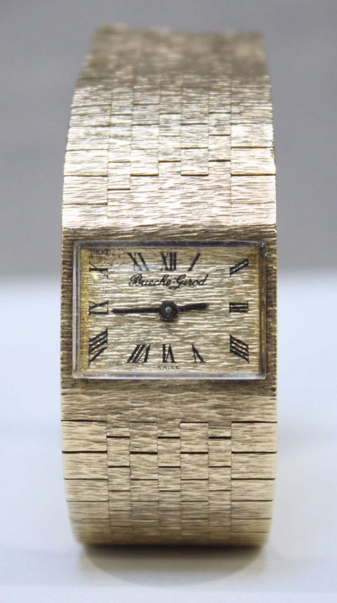 A 9ct gold ladies wristwatch by Bueche Girod c.1967, the rectangular gold, bark effect dial with