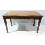 A large Oak desk with tooled leather top, the front having two Oak drawers, on squared supports,