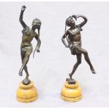 A pair of 19th century patinated Bronze figures of dancing Greek Fauns, one holding a stick and