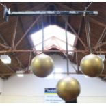 A Pawn Broker's shop sign in the form of 3 gilt coloured hanging spheres attached to a black metal