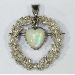 A platinum laurel wreath brooch set with rose cut diamonds, with a central heart shaped opal drop.