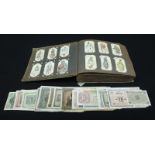 A small quantity of WW1 period Greek currency notes, together with an album of cigarette cards.