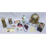 An assortment of mixed collectables including a brass divers helmet, a musical Davy lamp, a small