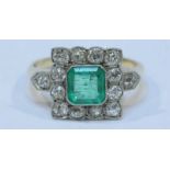 An 18ct gold emerald and diamond ring, the square top centrally set a square stepped cut emerald,