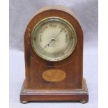 WITHDRAWN: An Edwardian mahogany mantel aneroid barometer, with a circular, silvered dial and the