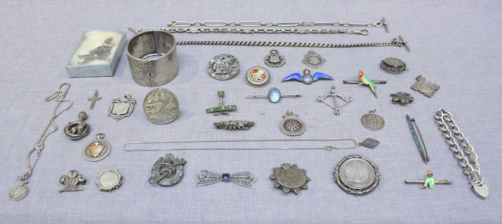 A collection of various Silver jewellery, including a heart locket bracelet, 4 enamel brooches