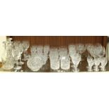 A large collection of glass drinking glasses, mostly Royal Doulton "Georgian" pattern, including