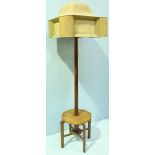 An Arts and Crafts oak standard lamp table with a stitched faux velum shade, tapered cylindrical