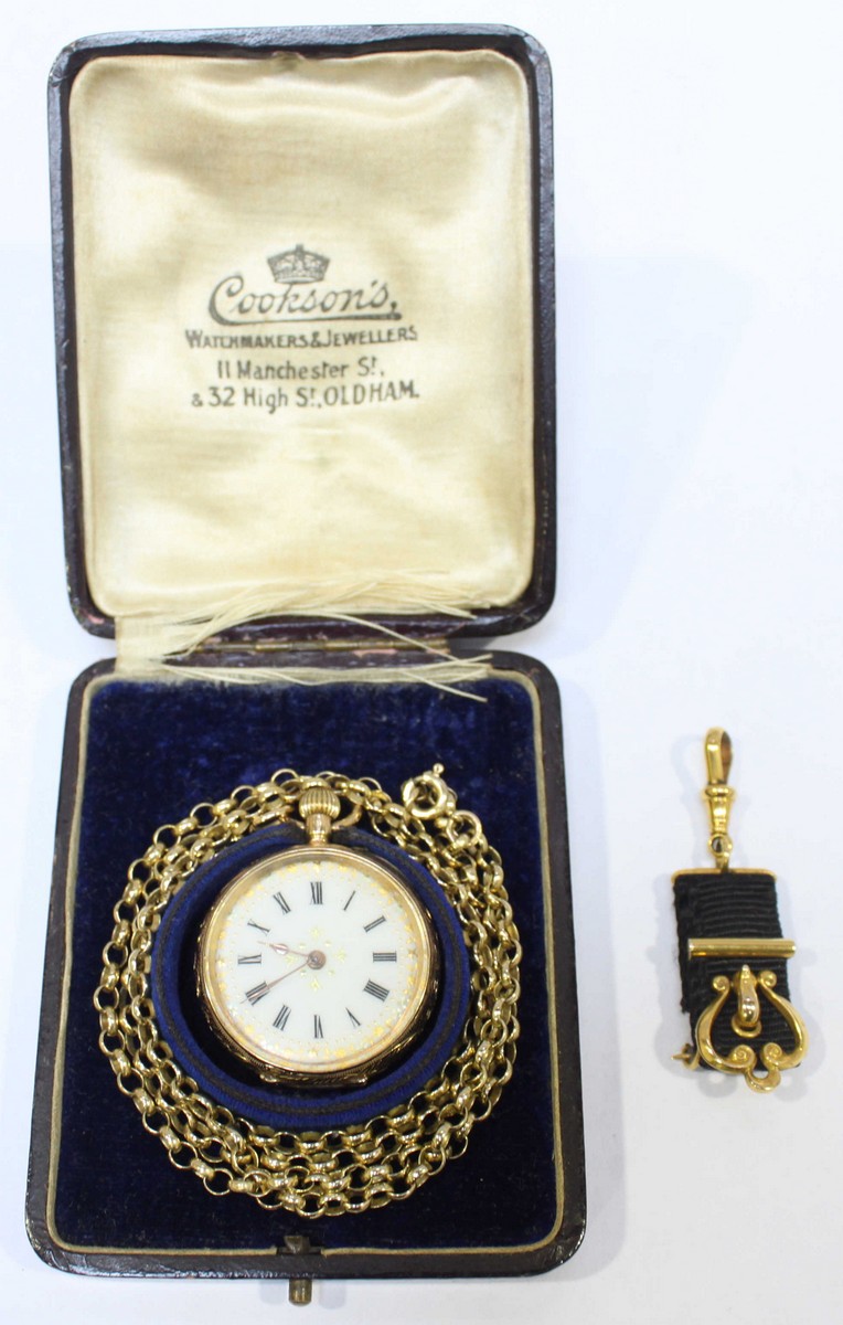 A 14k gold open face pocket watch, the white enamel dial with Roman numerals denoting hours and