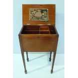 An Edwardian stained walnut sewing box/table, the hinged top opening to reveal a mounted,