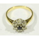 An 18ct gold Sapphire and Diamond Cluster ring, the brilliant cut diamonds approx 0.60 carats, 4.