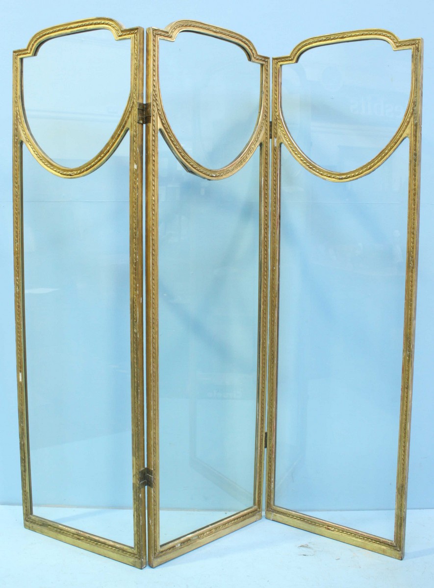 WITHDRAWN: A gilt painted wooden three fold dressing screen, each panel with clear glass. 178cm high