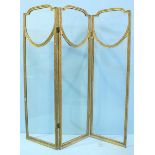 WITHDRAWN: A gilt painted wooden three fold dressing screen, each panel with clear glass. 178cm high