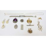 A assortment of various Silver items, including a curb link bracelet with engraved ID plate, a