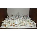 SECTION 13. A large quantity of assorted crested china, including pieces by Goss, Carlton ware and