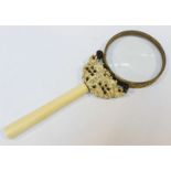 A late 19th / early 20th century gilt metal and carved ivory magnifying glass, 19cm long