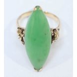 A 14ct gold Marquise cut jade ring, the large stone set in a floral galleried mount, 5.3g