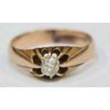 A yellow metal ring with old cushion cut diamond, the claw set stone approximately 0.30ct, ring