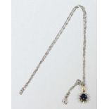 An 18ct white gold rope twist necklace with a Sapphire and Diamond pendant, mounted in 14ct yellow