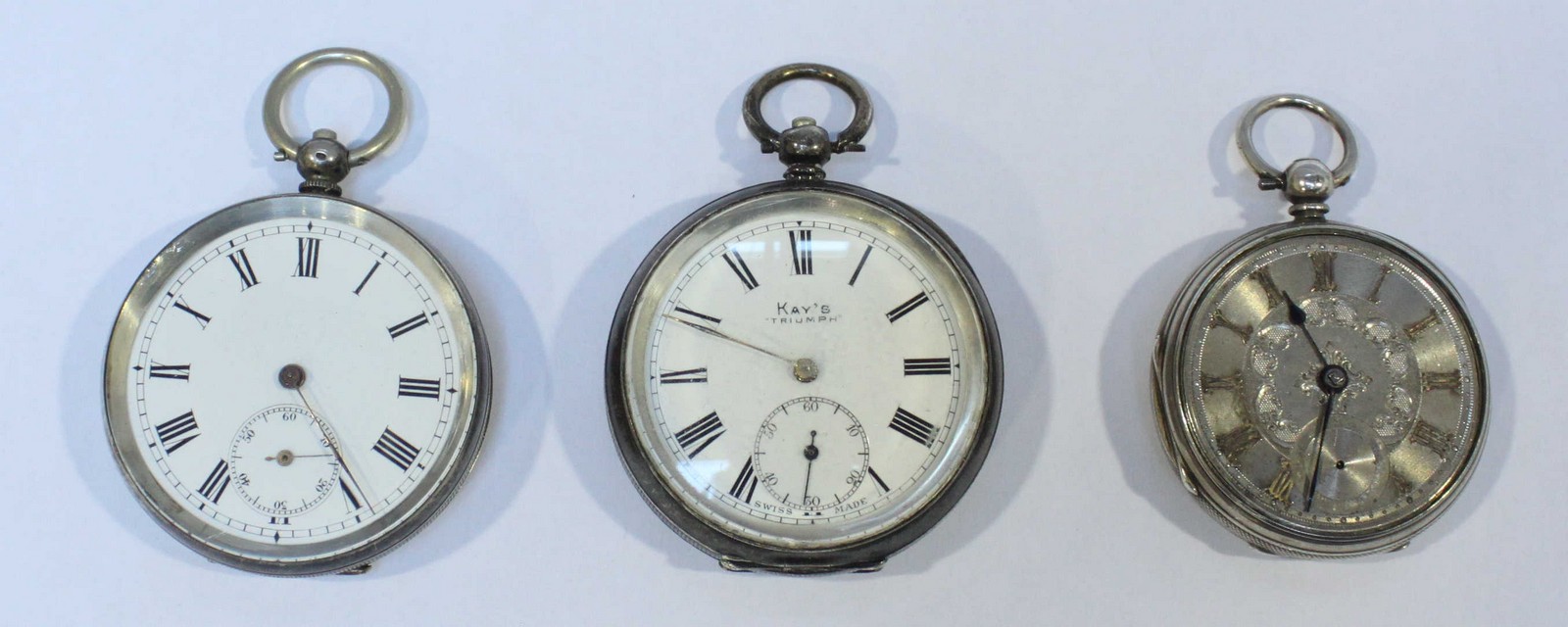 Three various silver pocket watches, two with white enamel dials, all three with Roman numerals