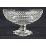 An early 19th century Irish cut glass comport, of elliptical form with crenulated rim above a band