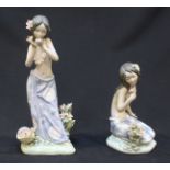 Two Lladro ceramic figures of Hawaiian girls, 'Aroma of the Islands' and 'Aloha.' The tallest figure