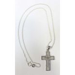 An unmarked white metal crucifix set with seventy-two 0.005 RBC diamonds, (testing as higher than