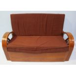 An Art Deco walnut bergere suite, comprising of a two seater sofa and three single armchairs. Each