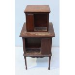 An Edwardian walnut graduated two-tier bookcase, with shaped apron and raised on tapering, square