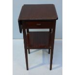 An Edwardian mahogany single drop-leaf side table, with short frieze drawer, under-tier and raised