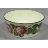 A 19th century Wymess pottery bowl typically painted with roses, impressed and painted marks to
