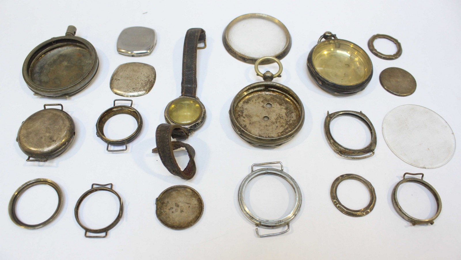 A selection of various Silver and white metal Pocket watch and Wristwatch cases and parts, including