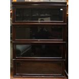 A stained wood Globe Wernick style 4 section bookcase with glass up-and-over doors, 126cm high by