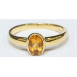 An 18ct gold ring set with an oval citrine, 3.93grams