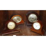 Four various wooden mantel clocks including two Edwardian mahogany examples with inlay.