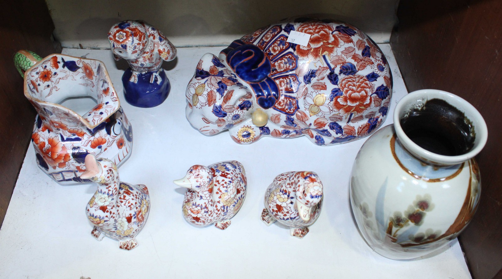 SECTION 16.. A small selection of modern Oriental pottery, including figures of 3 ducks, a large cat