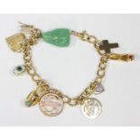 An 18ct gold charm bracelet, hung with a mixture of 18k, 14k and 9ct gold charms, total weight 36.