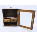 Of Railway interest: An Edwardian Oak glass fronted Smokers cabinet, the door opening to reveal