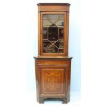 An Edwardian marquetry and mahogany standing corner cupboard, the top with single glazed door