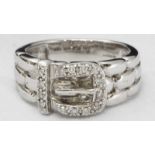 A 9ct white gold and diamond buckle ring, the buckle set with fourteen diamonds estimated 0.08