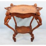 A 19th century continental walnut tray-top table, the entirety ornately carved with foliate,