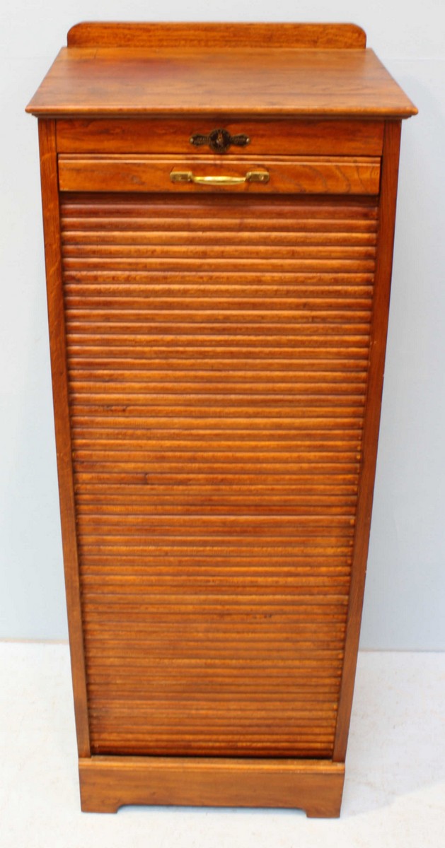 A 1920's oak music cabinet with locking tambour front, opening to reveal multiple wooden trays. - Image 3 of 4
