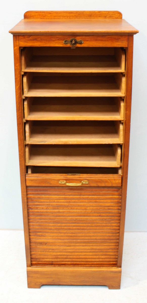 A 1920's oak music cabinet with locking tambour front, opening to reveal multiple wooden trays. - Image 2 of 4