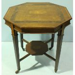 An Edwardian inlaid walnut octagonal table, with cross-banded top, under-tier and raised on
