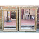 Two large bevelled glass mirrors in ornately decorated gilt frames, largest measuring 84cm by